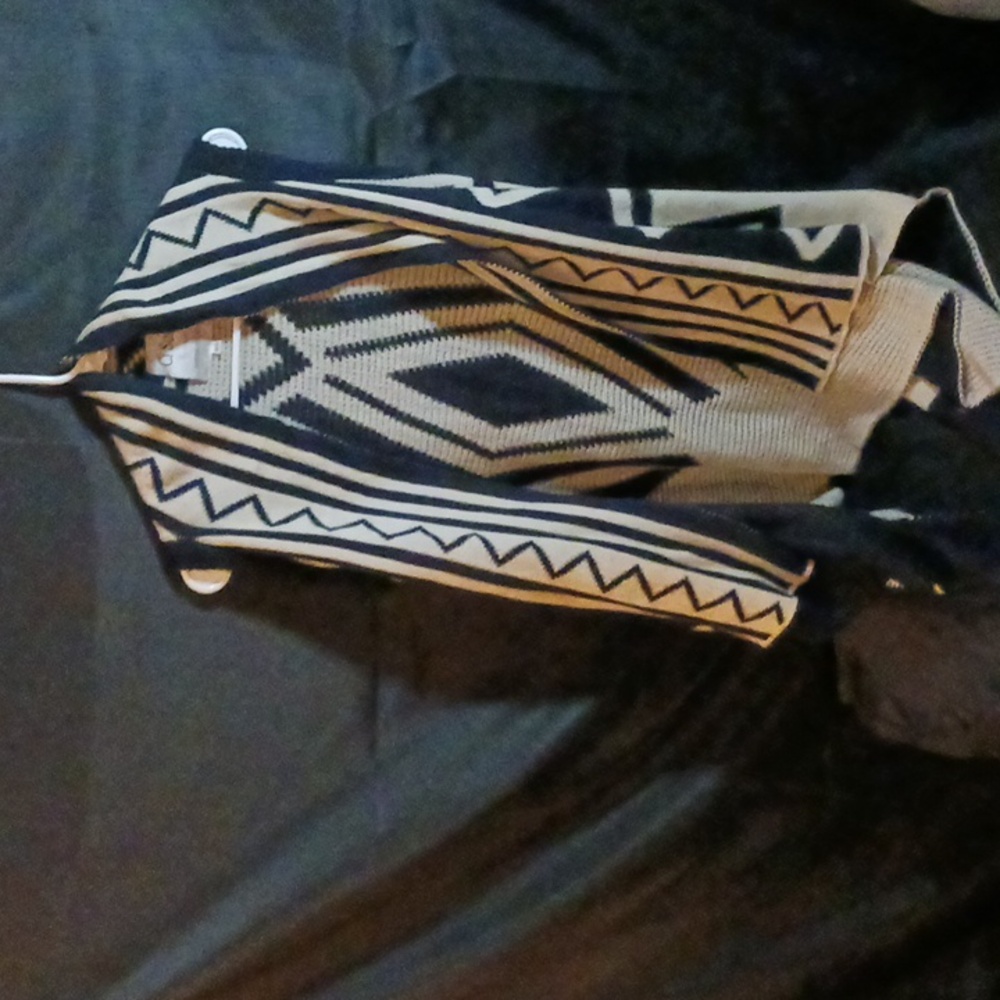 Navy blue sleeveless poncho vest